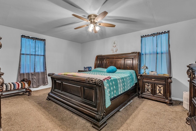 bedroom featuring ceiling fan and light colored carpet