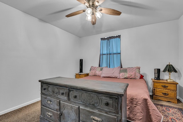 bedroom featuring ceiling fan and dark carpet