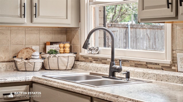 details with decorative backsplash and sink