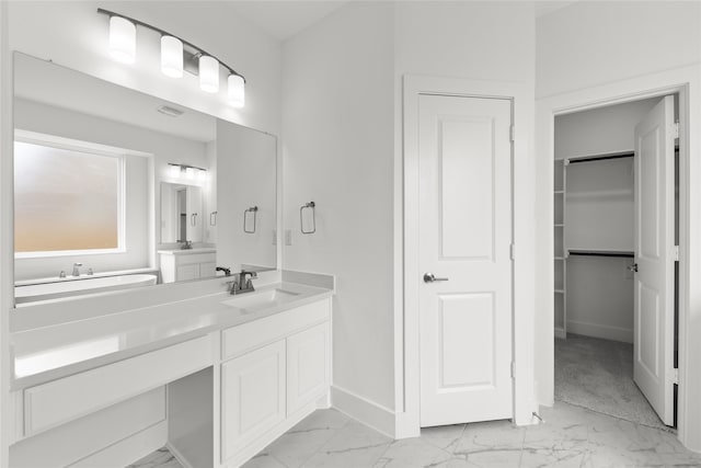 1727 Newport Dr, Cedar Hill, TX 75104 - full bathroom featuring marble look tile flooring, baseboards, vanity, and a spacious closet