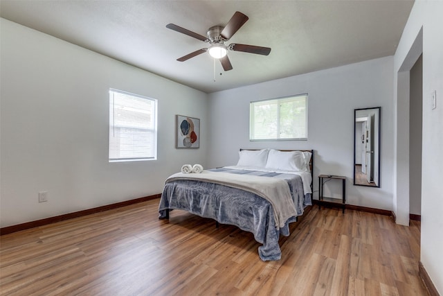 bedroom featuring ceiling fan and light hardwood / wood-style floors