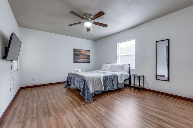 bedroom featuring ceiling fan and hardwood / wood-style floors