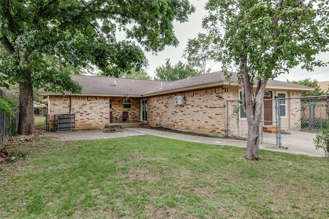 rear view of property with a yard