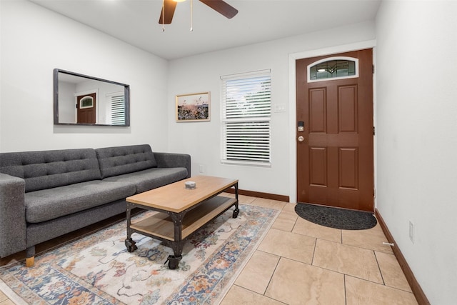 tiled living room with ceiling fan