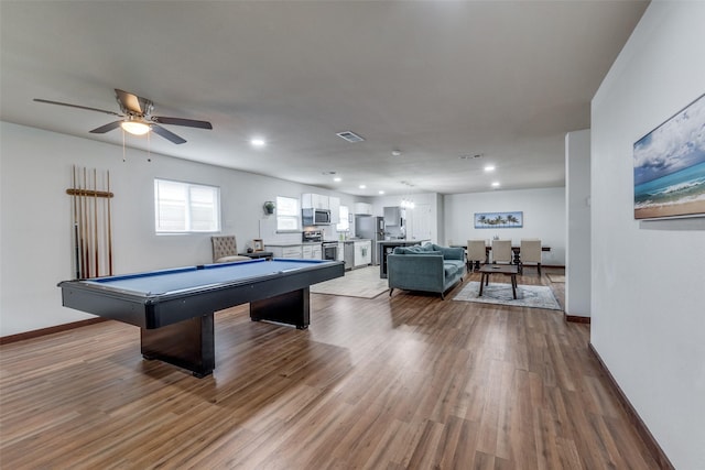 game room featuring wood-type flooring, ceiling fan, and billiards