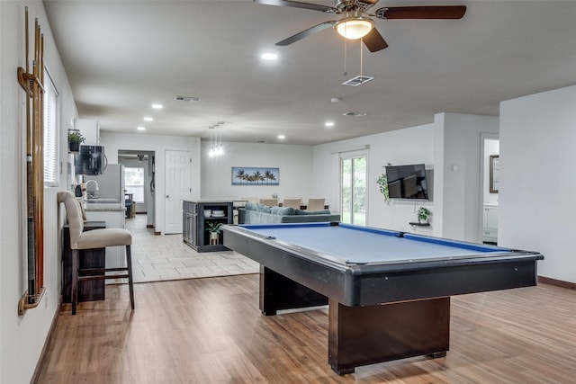 rec room with ceiling fan, billiards, and light hardwood / wood-style flooring