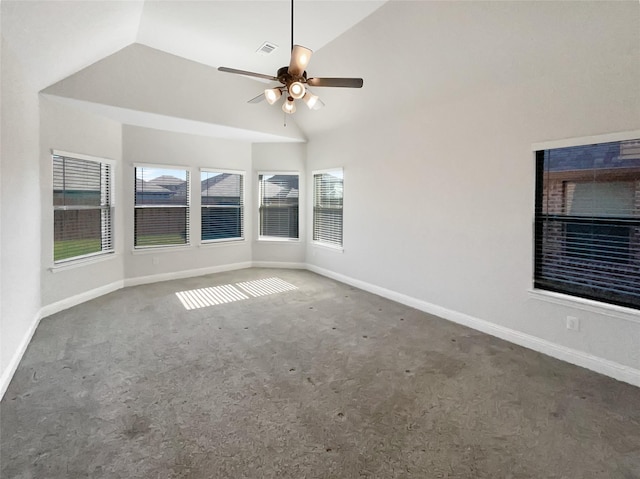 carpeted spare room featuring ceiling fan and lofted ceiling