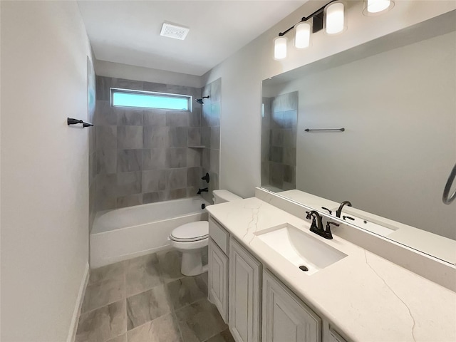 full bathroom featuring toilet, tiled shower / bath combo, and vanity