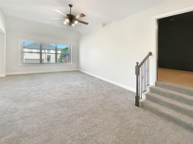 unfurnished living room featuring carpet floors and ceiling fan