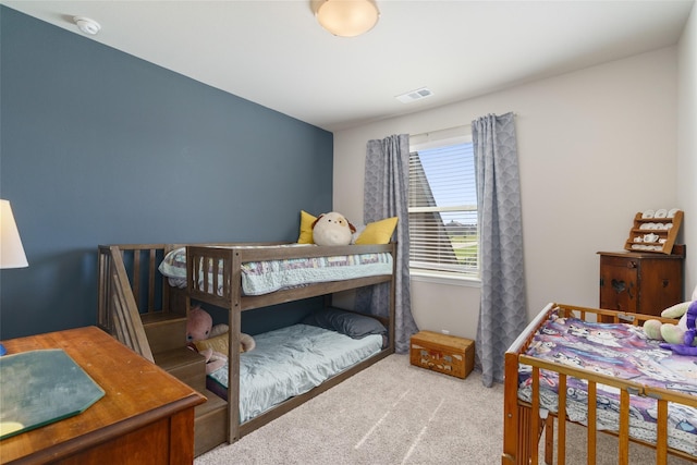 carpeted bedroom with visible vents