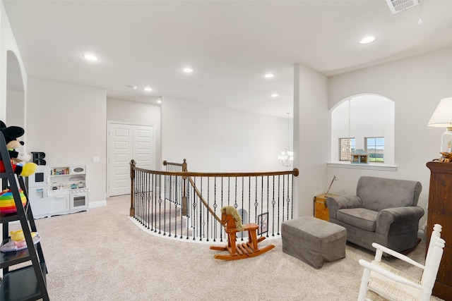 sitting room featuring carpet floors, visible vents, a notable chandelier, and recessed lighting