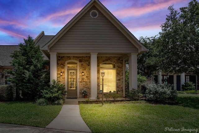 view of front of property with a yard