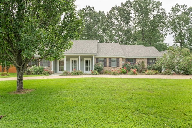 ranch-style home featuring a front yard