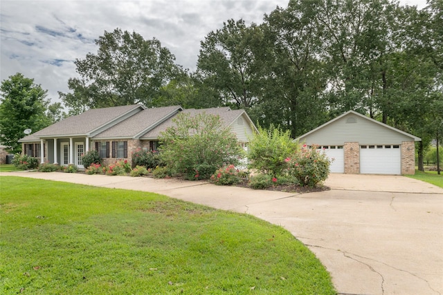 view of front of property with a front yard and a garage