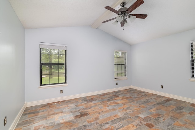 empty room featuring lofted ceiling with beams and ceiling fan