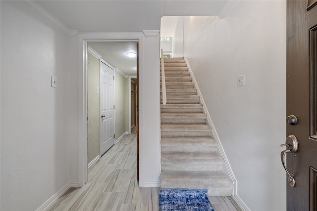 staircase with crown molding