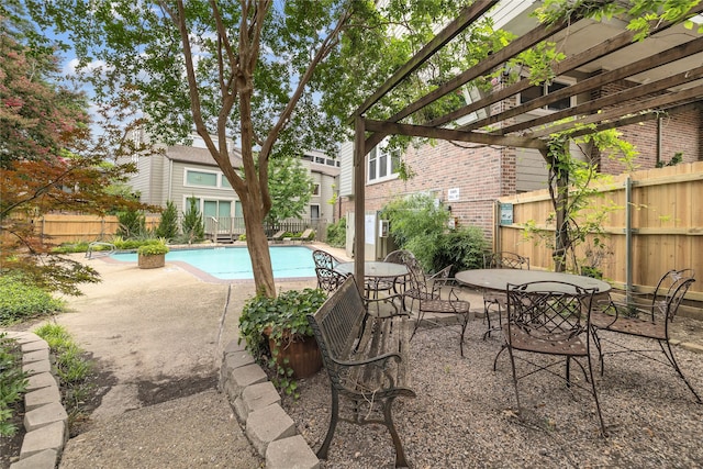 view of swimming pool with a pergola and a patio area