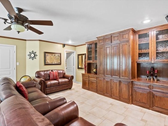 living room featuring ceiling fan and ornamental molding