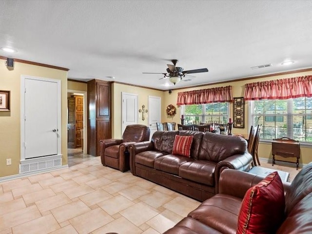 living room with ceiling fan and crown molding