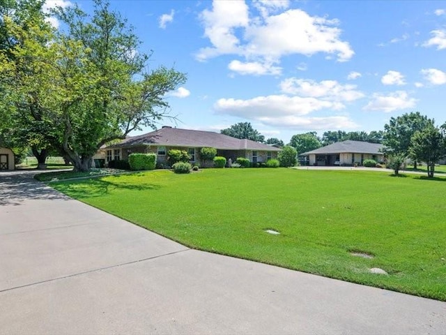 view of home's community with a lawn