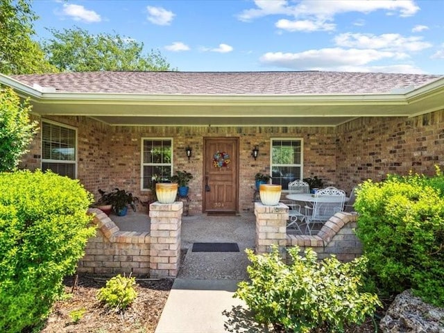 doorway to property with covered porch