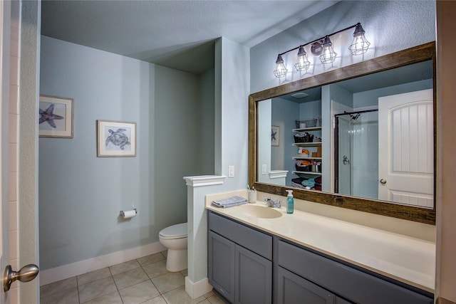 bathroom featuring vanity, tile patterned flooring, toilet, a textured ceiling, and an enclosed shower