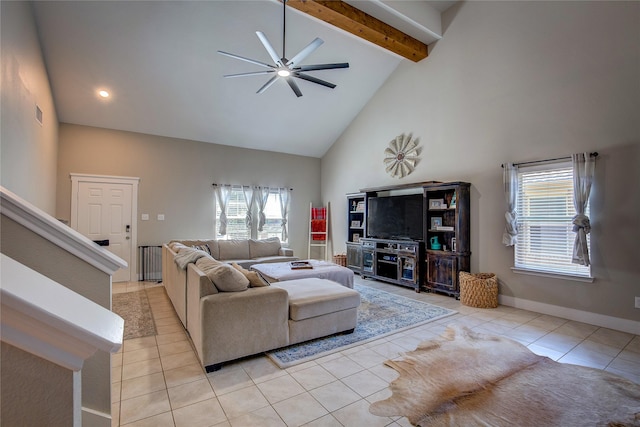 tiled living room featuring ceiling fan, beamed ceiling, and high vaulted ceiling