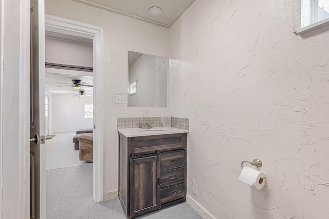 bathroom with ceiling fan and vanity