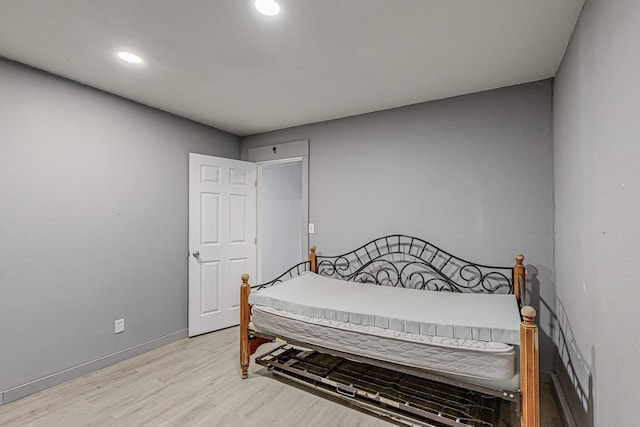 bedroom with light wood-type flooring