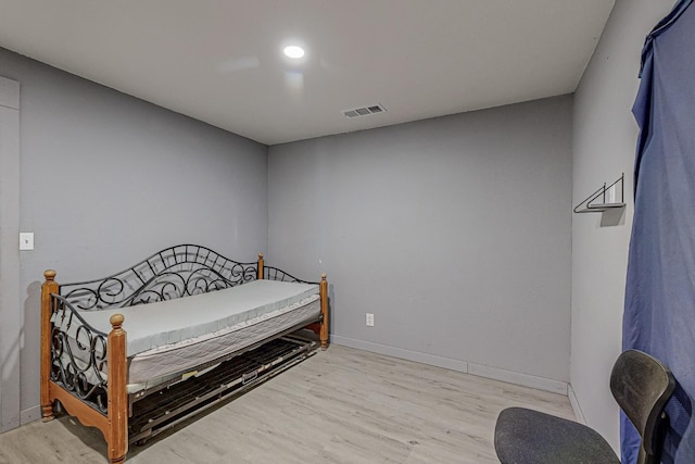 bedroom with light wood-type flooring