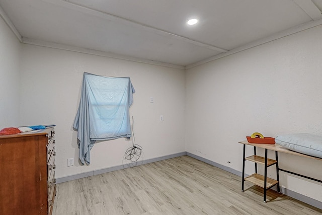 unfurnished room featuring crown molding and light hardwood / wood-style flooring