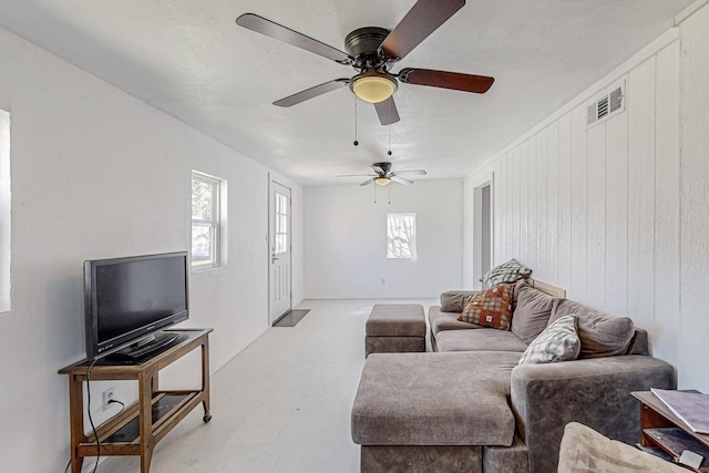 living room featuring wood walls