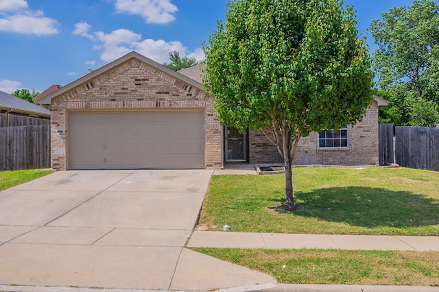 view of front facade featuring a garage and a front lawn