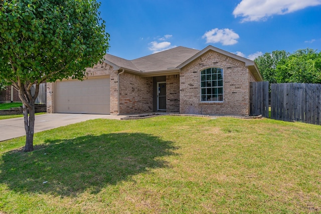 ranch-style home featuring a garage and a front lawn