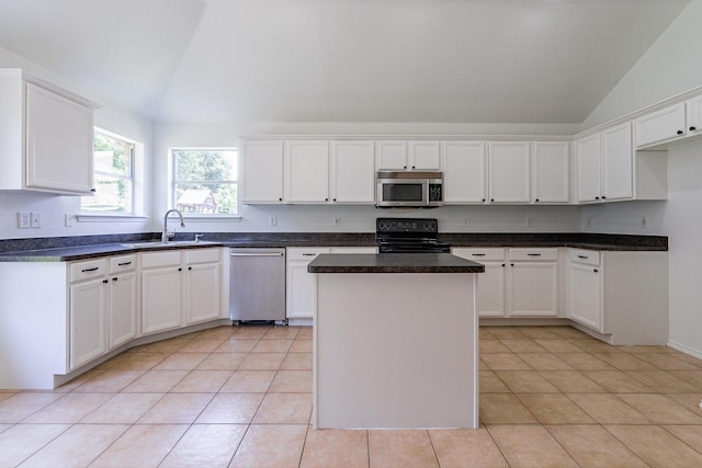 kitchen featuring white cabinetry, appliances with stainless steel finishes, and a center island