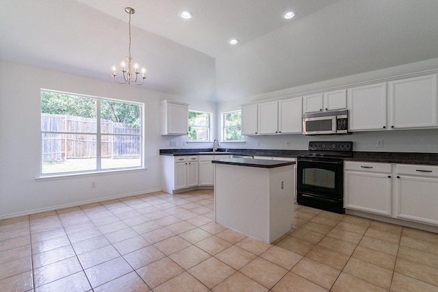 kitchen featuring pendant lighting, black electric range oven, light tile patterned floors, white cabinetry, and an inviting chandelier