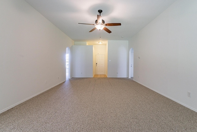 empty room featuring light carpet and ceiling fan