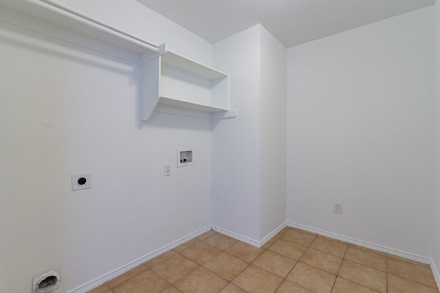 laundry room with light tile patterned floors, hookup for a washing machine, and electric dryer hookup