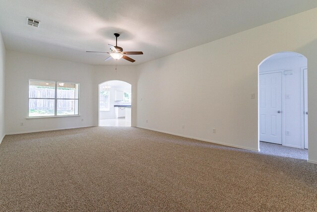 unfurnished room featuring ceiling fan and carpet floors