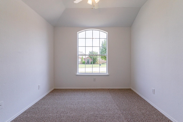 carpeted spare room with lofted ceiling and ceiling fan