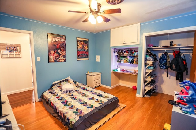 bedroom featuring a closet, ceiling fan, and light hardwood / wood-style flooring