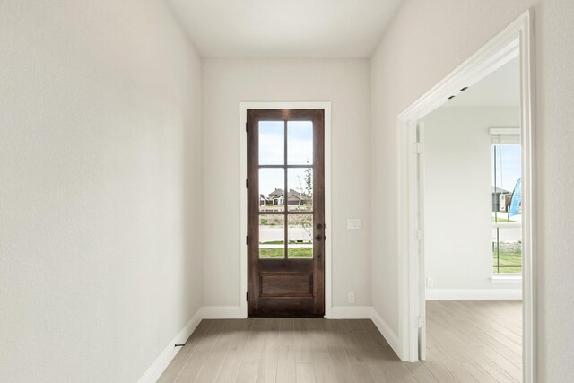 doorway to outside featuring light hardwood / wood-style flooring