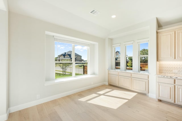 interior space with recessed lighting, visible vents, plenty of natural light, and light wood-style flooring