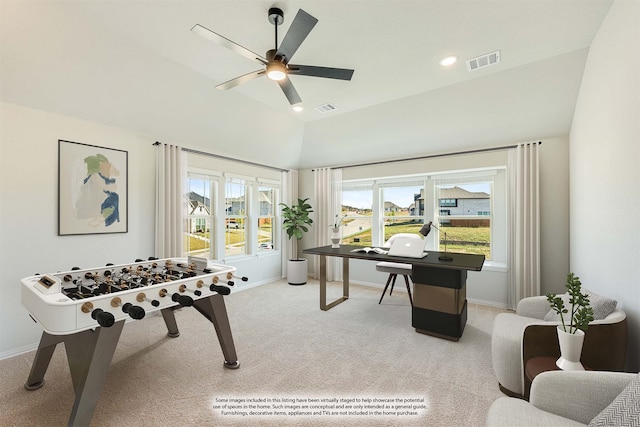 playroom featuring vaulted ceiling, light colored carpet, a healthy amount of sunlight, and ceiling fan