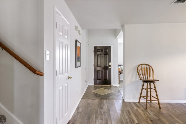 entrance foyer featuring dark hardwood / wood-style flooring