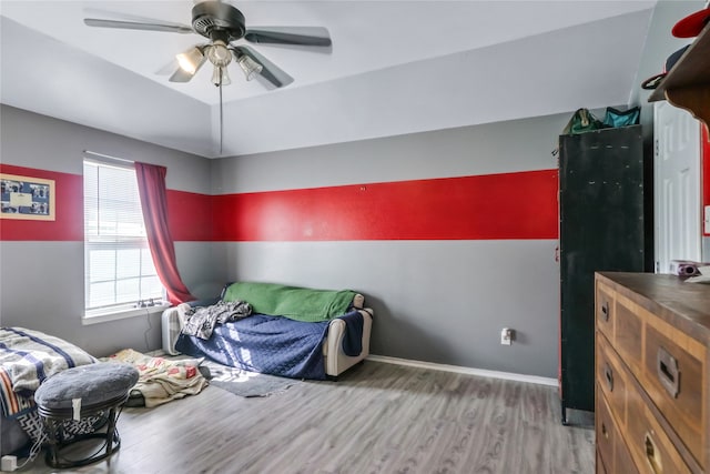 bedroom featuring wood-type flooring and ceiling fan