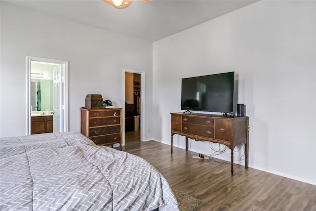 bedroom featuring hardwood / wood-style floors and ensuite bath