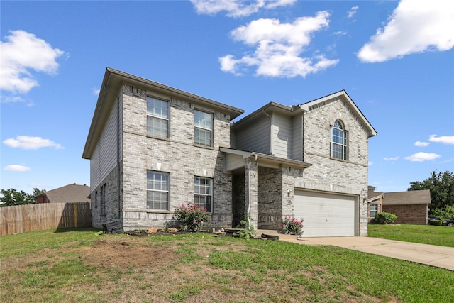 view of front of house featuring a front lawn and a garage