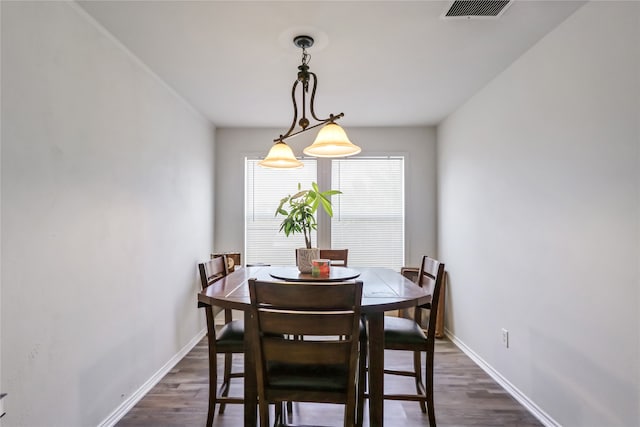 dining area with dark wood-type flooring