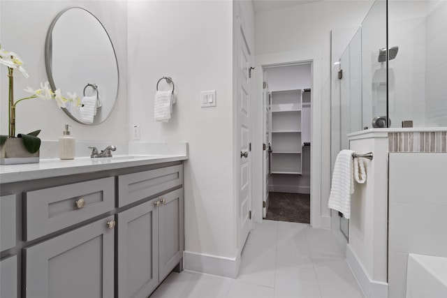 bathroom with vanity and tiled shower